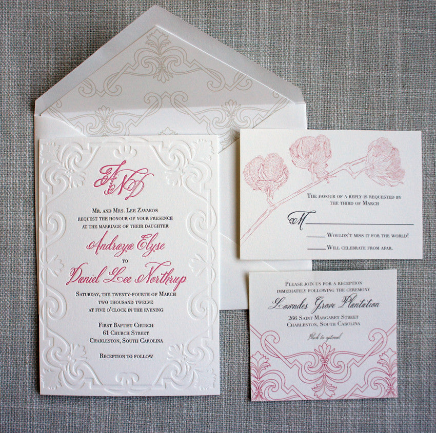 Scroll Letterpress Invitation with inserts featuring a cotton blossom. Also shown, custom printed envelope liner with a repeating scroll pattern.